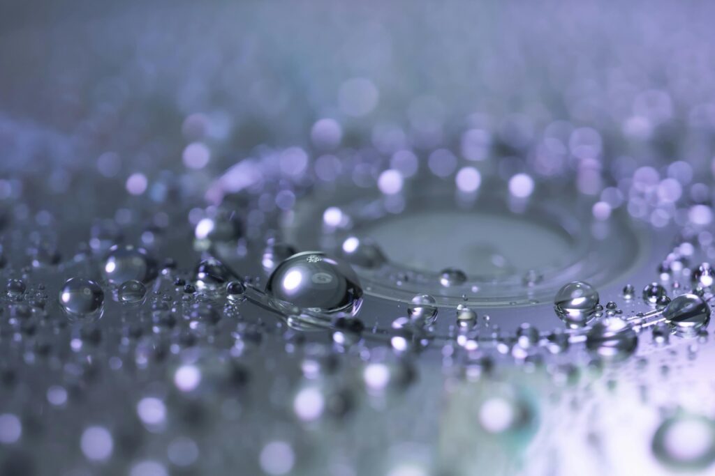 Captivating macro photograph of water droplets highlighting reflection and clarity.
